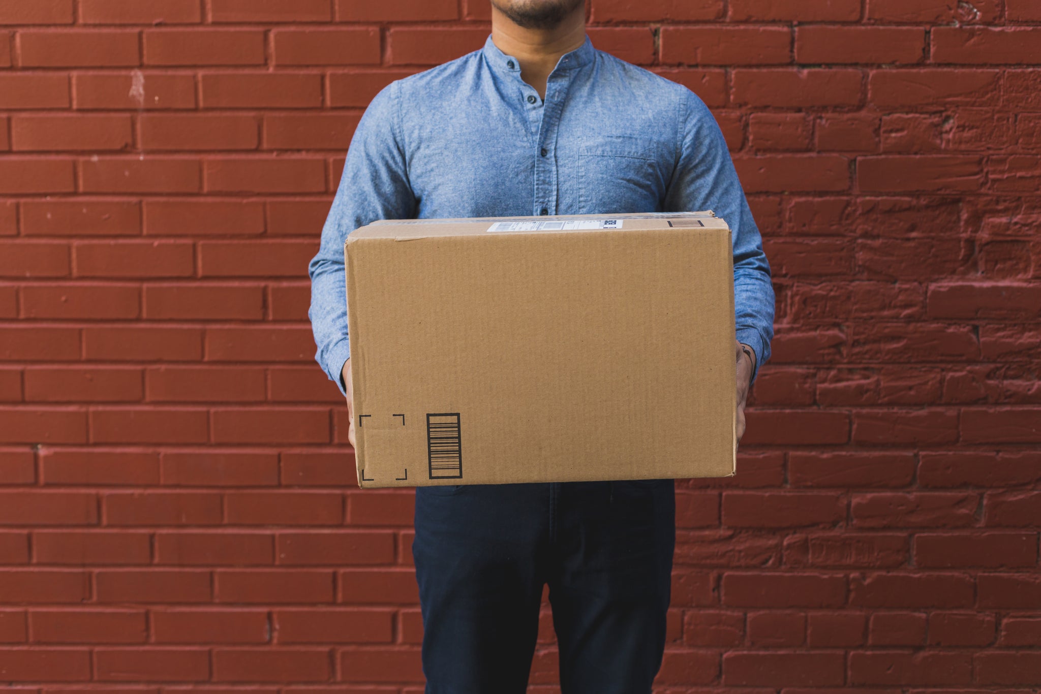 man with shipping box